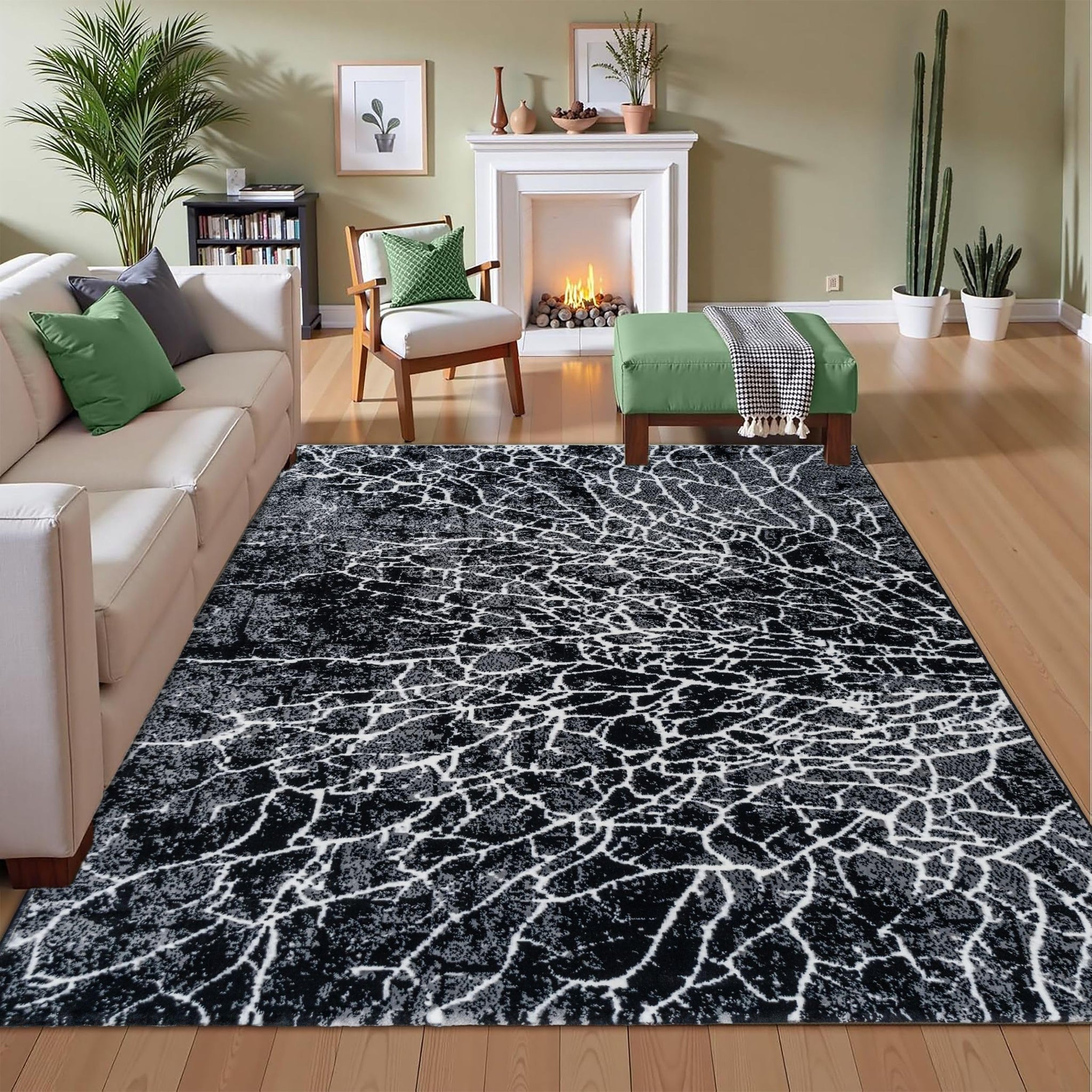 Black Lava Turkish rug with a geometric pattern placed on a wooden floor in a living room, styled with a sofa and armchair for a modern, cozy look