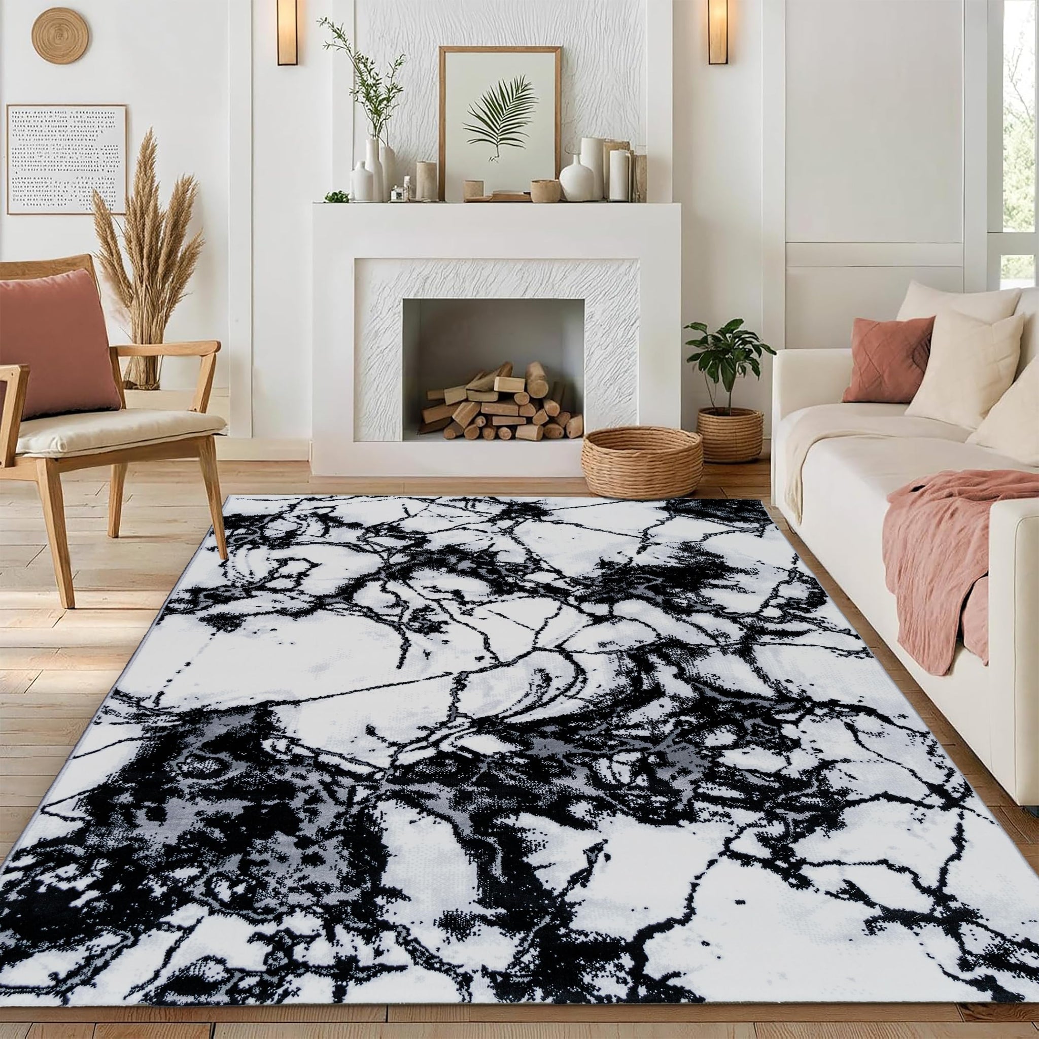 Modern medium-pile Black Marble Turkish rug with a black and white marble-like pattern, placed on the floor in a stylish room with a fireplace, chairs, and a sofa