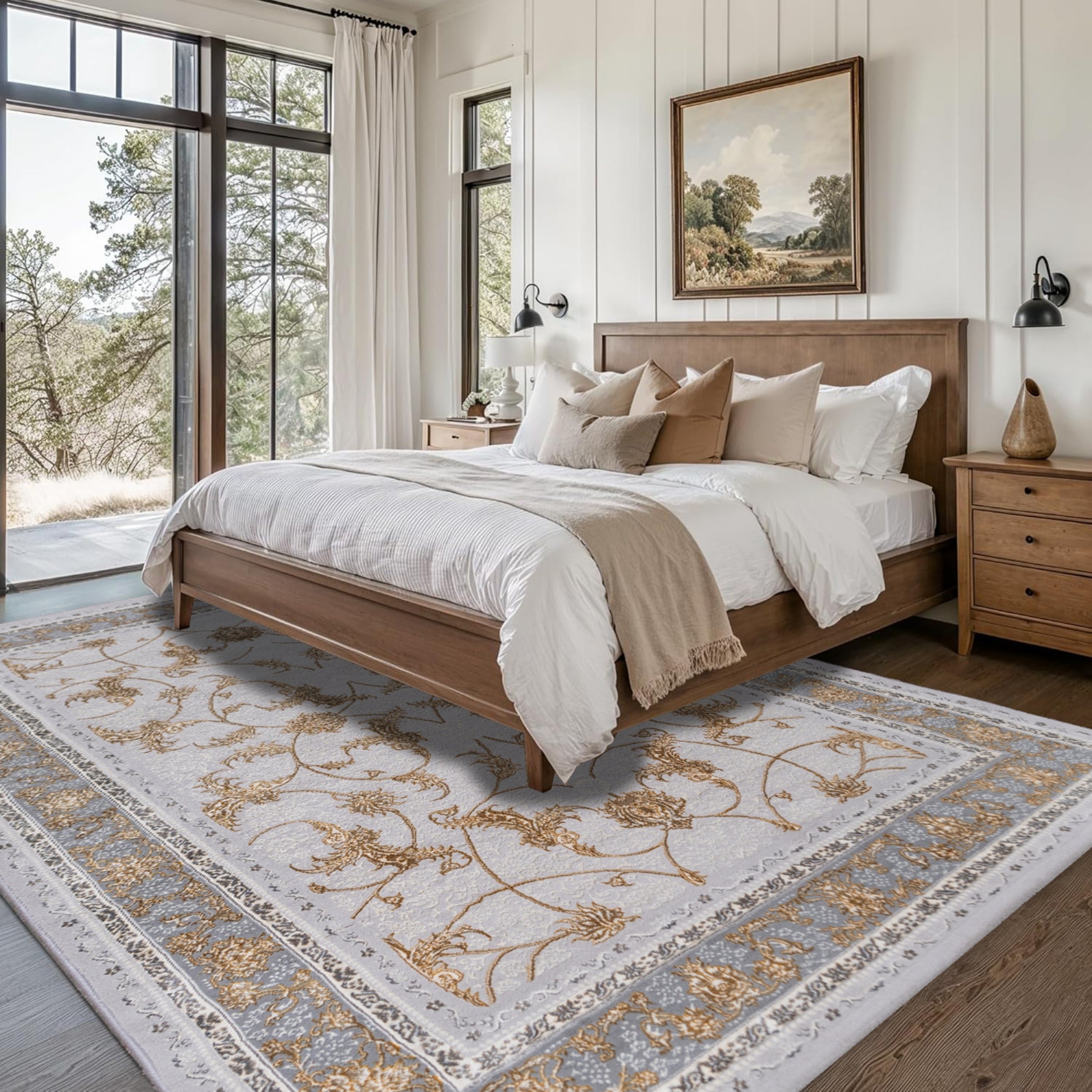 Bedroom styled with the Antique Silver Turkish rug featuring gray floral patterns, placed under a bed with neutral bedding to create a serene and sophisticated atmosphere